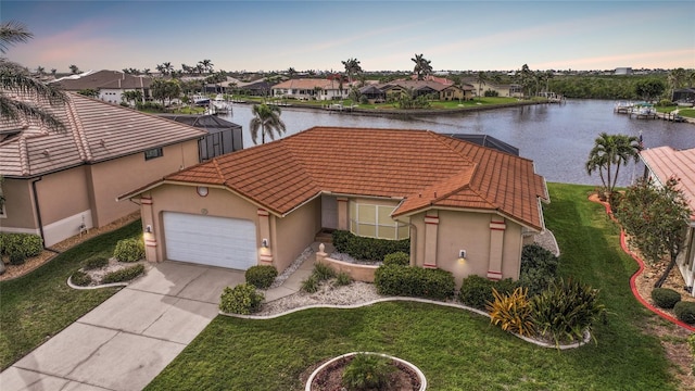 aerial view with a residential view and a water view