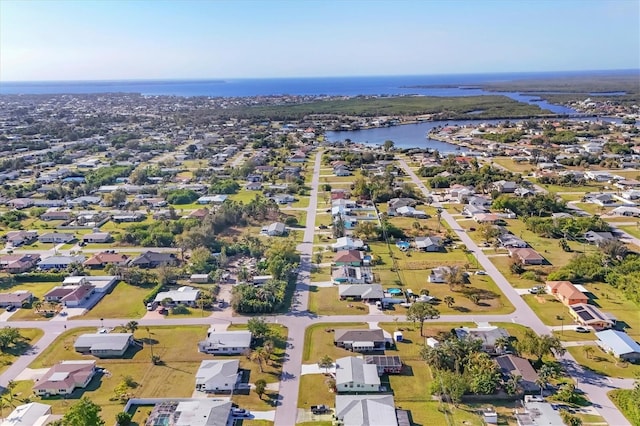 aerial view with a water view and a residential view