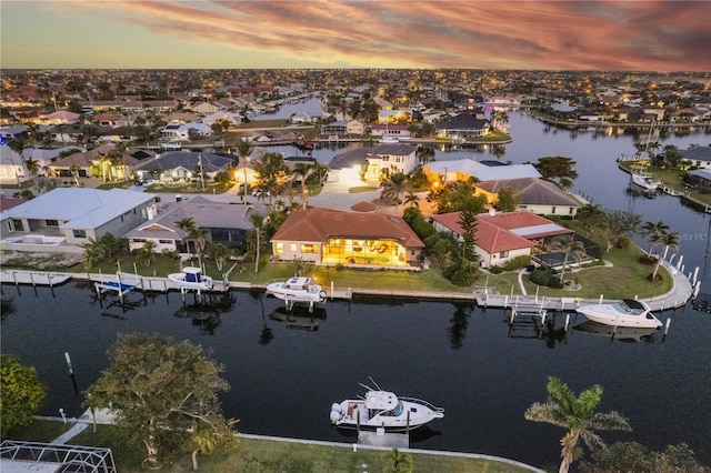 aerial view with a residential view and a water view