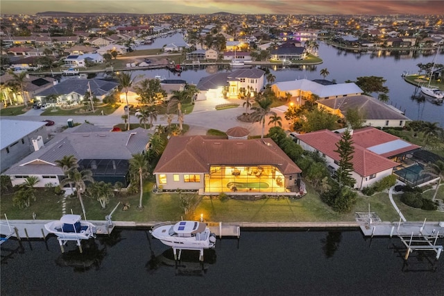 aerial view featuring a residential view and a water view