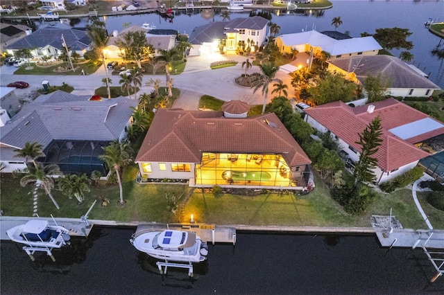 birds eye view of property featuring a residential view and a water view