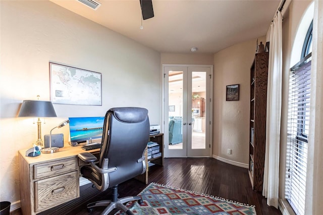 office space featuring dark wood-style floors, visible vents, a healthy amount of sunlight, and french doors