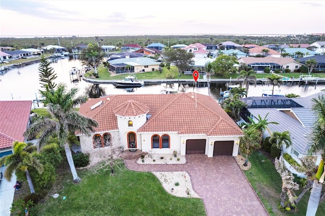 aerial view featuring a residential view and a water view