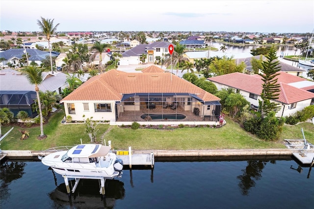 aerial view featuring a residential view and a water view