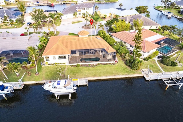 aerial view with a residential view and a water view