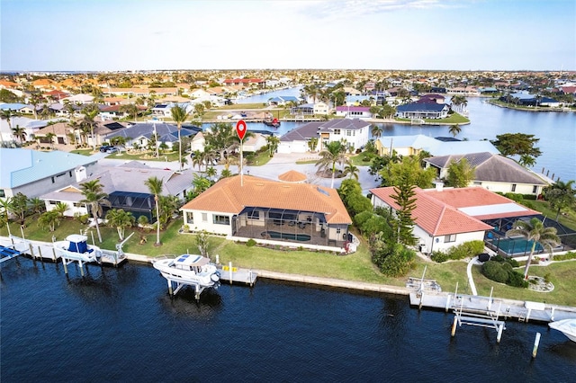 birds eye view of property featuring a residential view and a water view