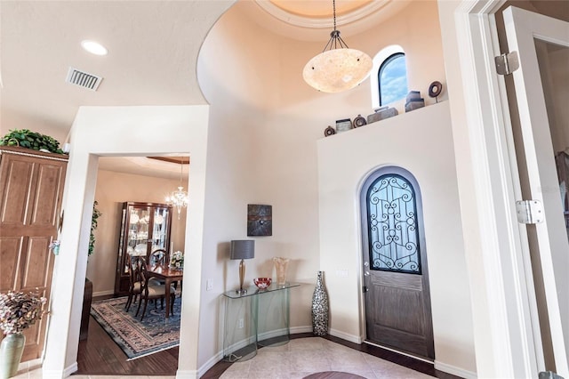 entrance foyer with recessed lighting, visible vents, and baseboards