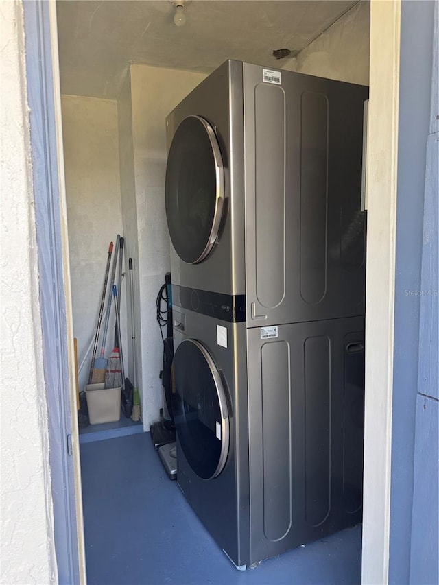 laundry area featuring laundry area and stacked washer / dryer