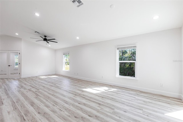 empty room featuring recessed lighting, visible vents, light wood-style flooring, and baseboards