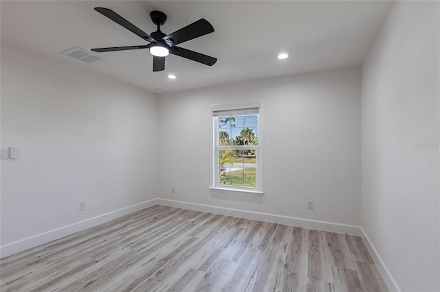 unfurnished room with baseboards, visible vents, ceiling fan, light wood-style floors, and recessed lighting