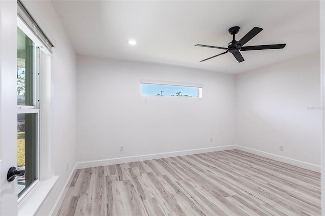 unfurnished room with light wood-type flooring, baseboards, a ceiling fan, and recessed lighting