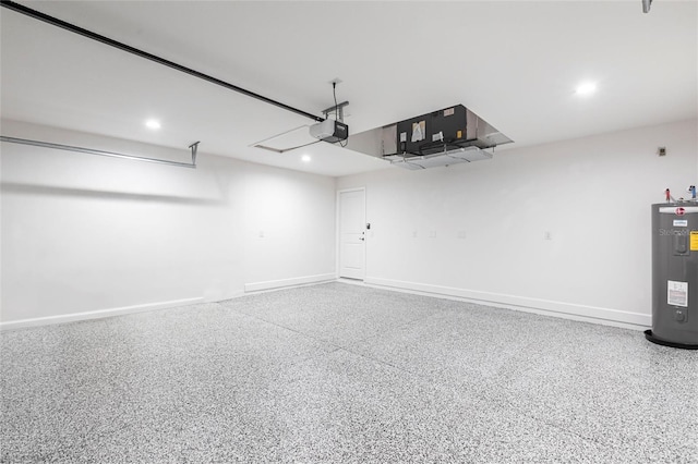 garage featuring baseboards, recessed lighting, electric water heater, and a garage door opener