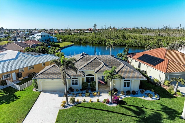 birds eye view of property with a water view