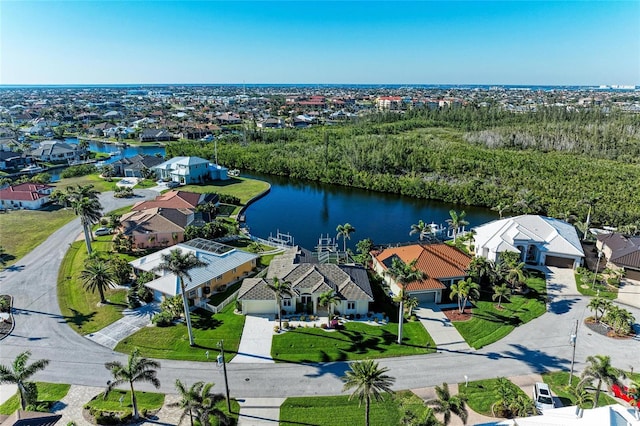 bird's eye view featuring a water view and a residential view