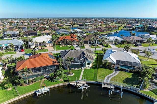 aerial view featuring a water view and a residential view