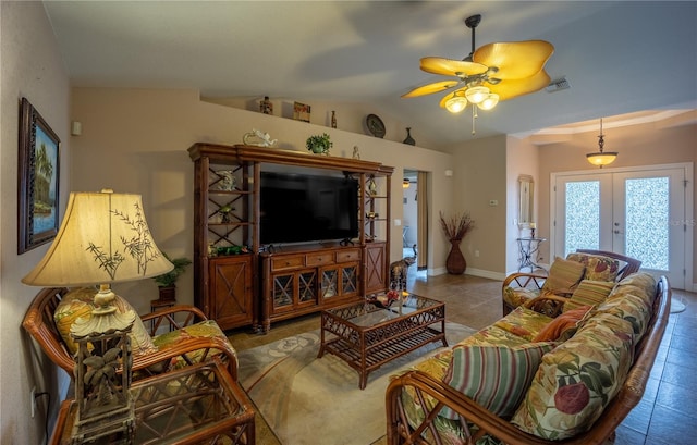 living room with visible vents, baseboards, vaulted ceiling, french doors, and tile patterned floors