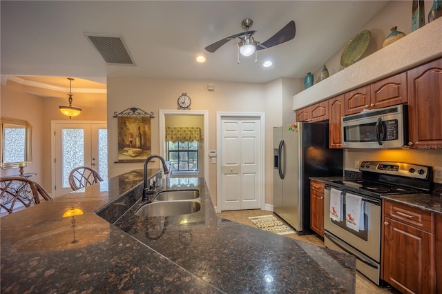 kitchen featuring appliances with stainless steel finishes, a healthy amount of sunlight, visible vents, and a sink