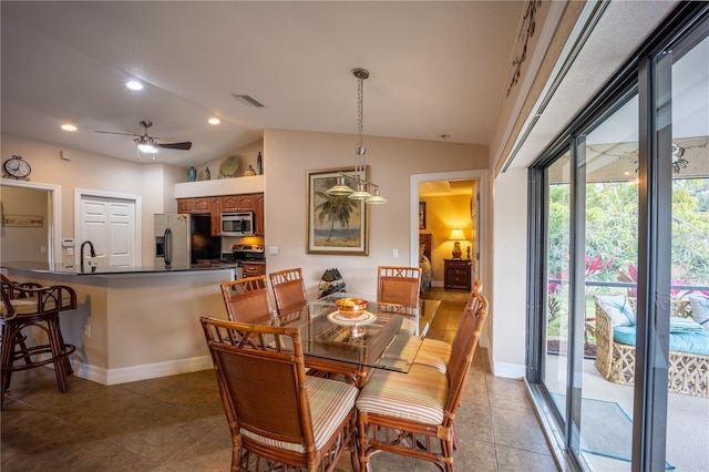 dining space featuring lofted ceiling, recessed lighting, visible vents, baseboards, and tile patterned floors