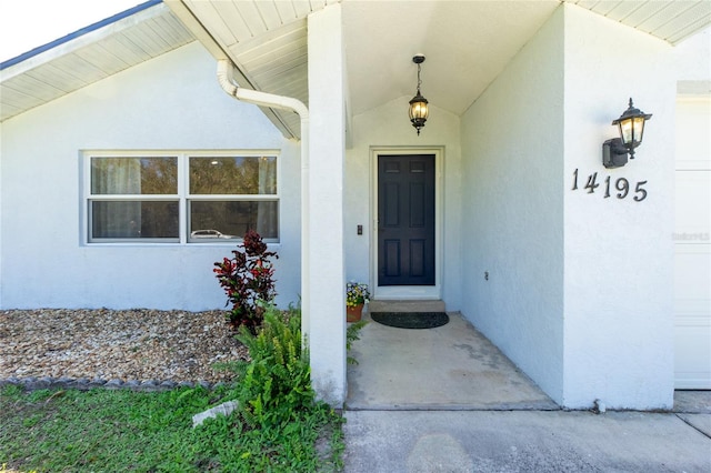 14195 Brisk Ave, Port Charlotte, FL 33953 - doorway to property with stucco siding