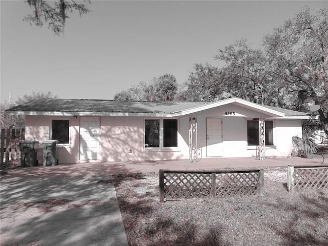 view of front of house with fence