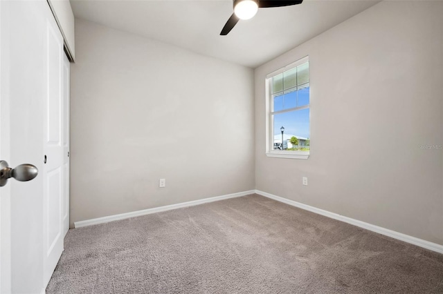 unfurnished bedroom with ceiling fan, a closet, carpet flooring, and baseboards