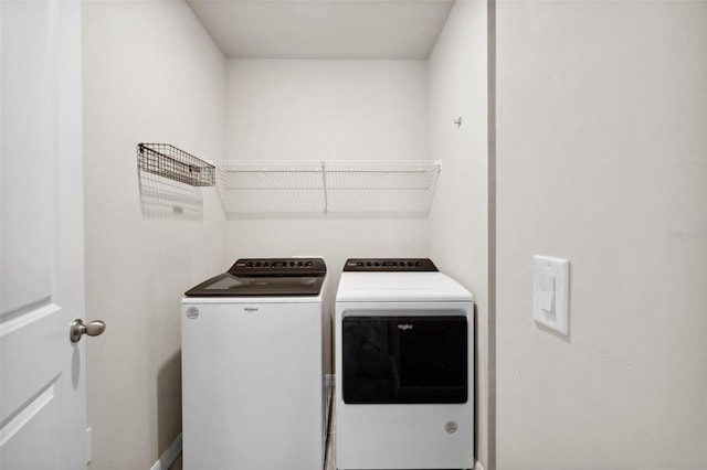 clothes washing area with laundry area and separate washer and dryer