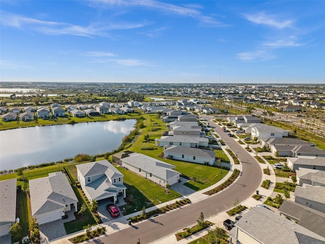 bird's eye view with a water view and a residential view