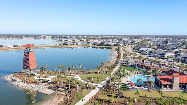 bird's eye view featuring a water view and a residential view