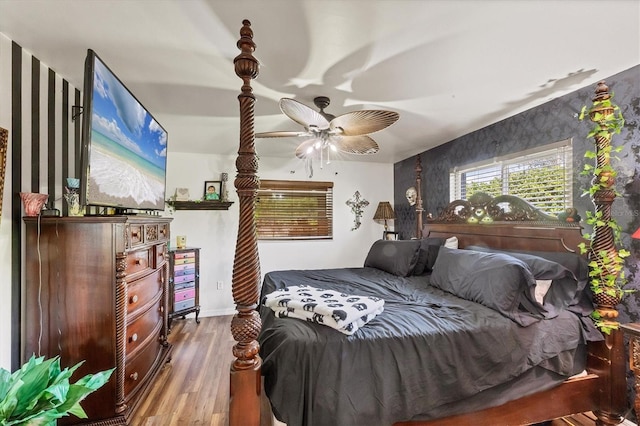 bedroom featuring a ceiling fan and wood finished floors