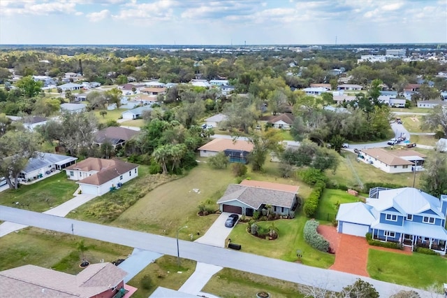 birds eye view of property with a residential view