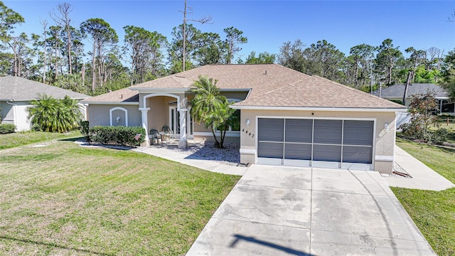 single story home with stucco siding, a shingled roof, and a front lawn