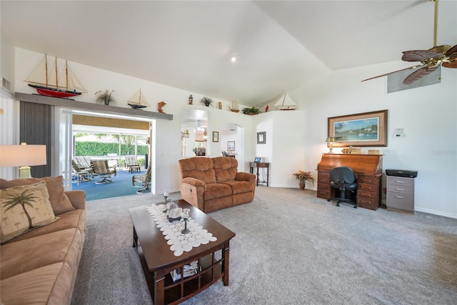 living area featuring visible vents, baseboards, high vaulted ceiling, carpet floors, and ceiling fan