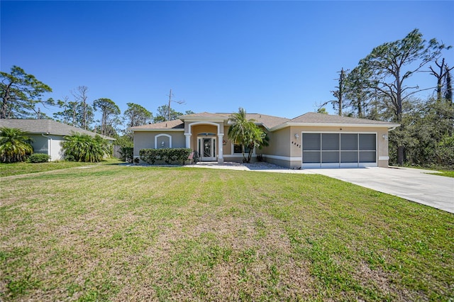 ranch-style house featuring a front yard, an attached garage, driveway, and stucco siding