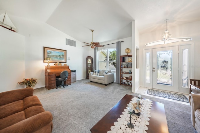 foyer with visible vents, baseboards, ceiling fan, vaulted ceiling, and carpet floors