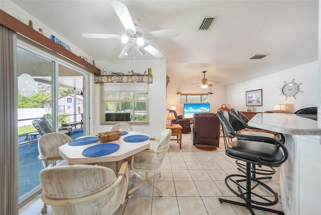 dining room featuring light tile patterned floors, visible vents, and ceiling fan