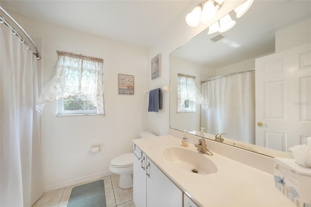 bathroom featuring tile patterned floors, visible vents, toilet, and a healthy amount of sunlight