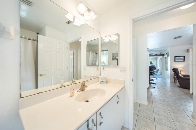 bathroom featuring tile patterned floors, visible vents, and vanity