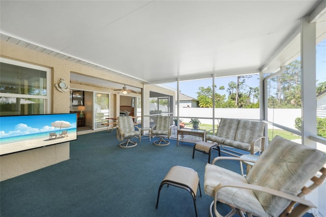 sunroom with a ceiling fan