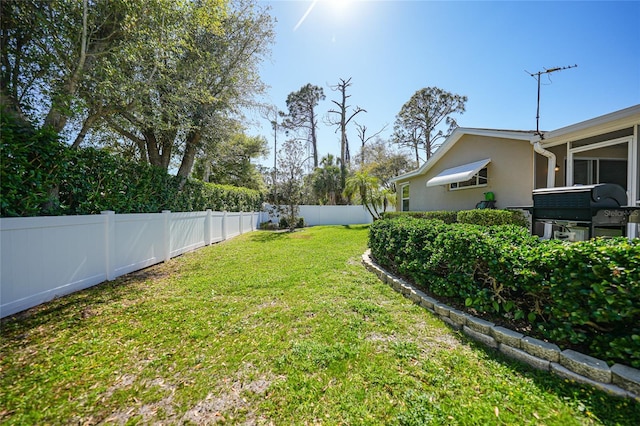 view of yard featuring a fenced backyard