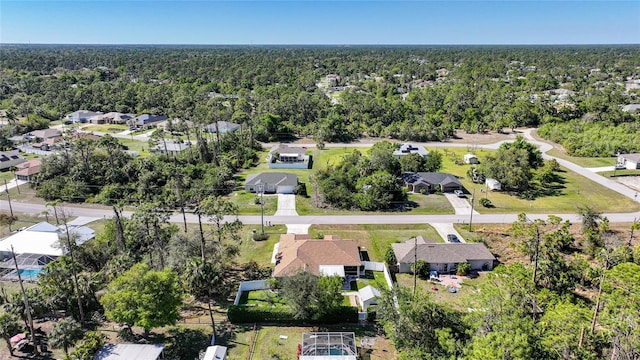 drone / aerial view with a view of trees and a residential view