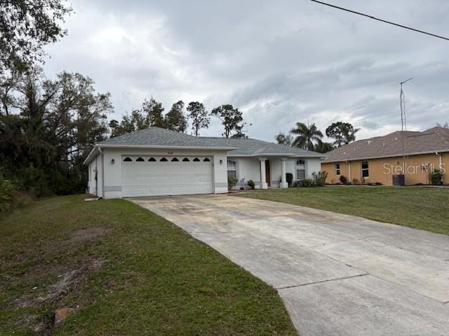 ranch-style house featuring a garage, concrete driveway, a front lawn, and stucco siding