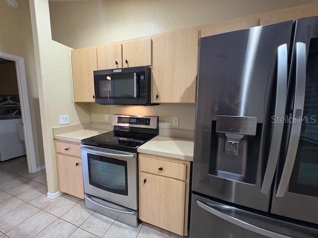 kitchen featuring light brown cabinets, appliances with stainless steel finishes, and light countertops