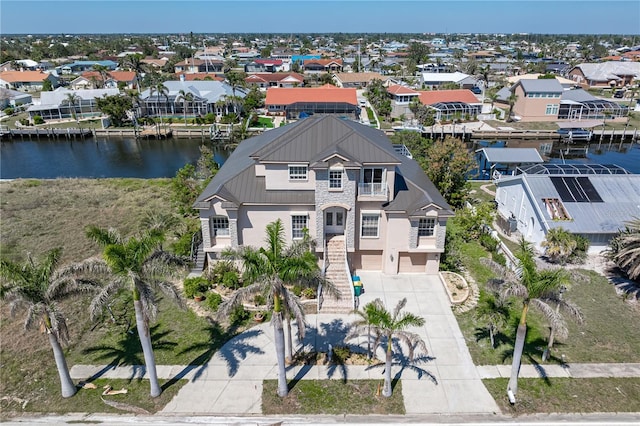 aerial view featuring a water view and a residential view