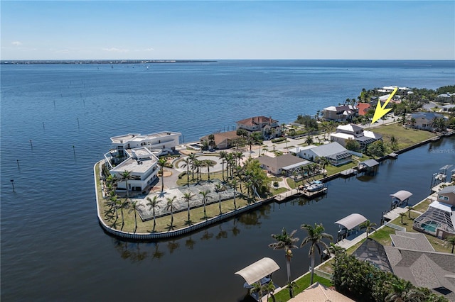 bird's eye view featuring a water view and a residential view