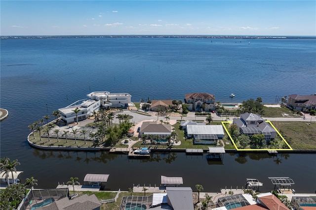 birds eye view of property featuring a water view and a residential view