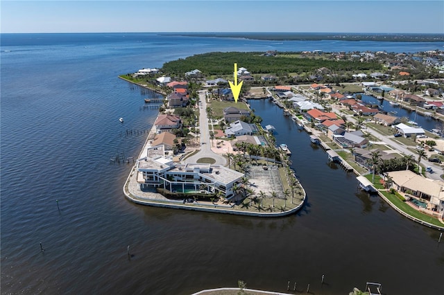 drone / aerial view featuring a water view and a residential view