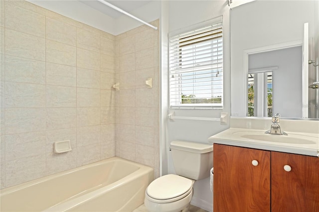 full bathroom featuring shower / bath combination, vanity, and toilet