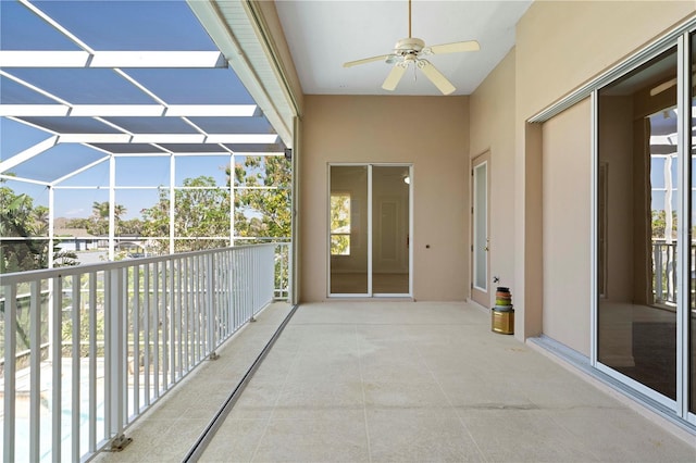 balcony with ceiling fan and a sunroom