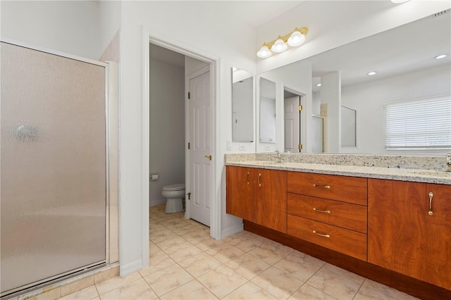 full bath featuring toilet, a sink, a shower stall, tile patterned floors, and double vanity