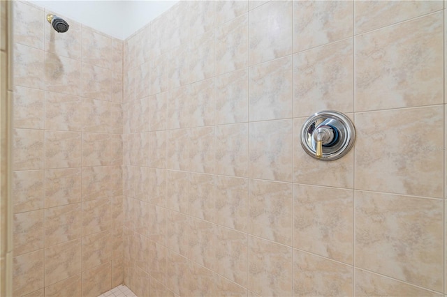 full bath featuring tiled shower